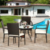 Stackable patio dining chairs with cushioned armrests, made of weather-resistant PE rattan, ideal for outdoor use.