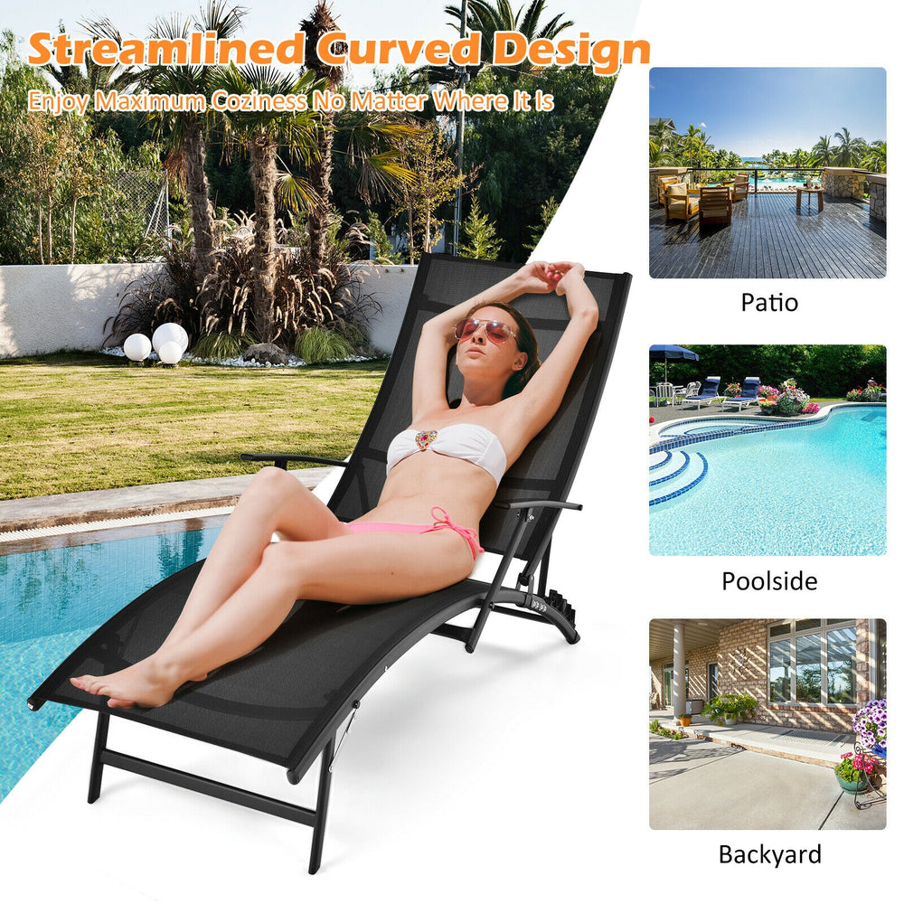 Black patio folding lounge chair with ergonomic armrests and adjustable backrest, perfect for poolside relaxation.