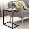 Stylish 26-inch dark brown side table with sturdy steel frame, perfect for holding laptops and snacks beside a sofa.