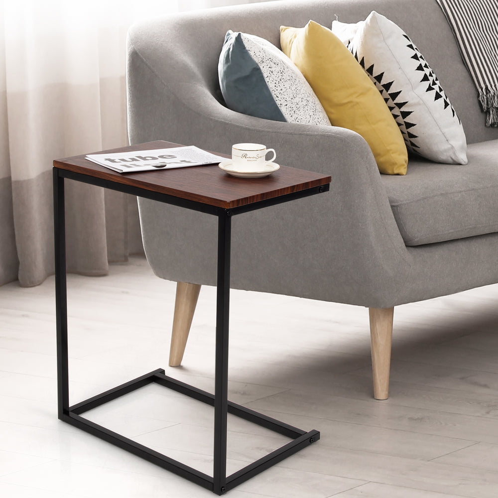 Stylish 26-inch dark brown side table with sturdy steel frame, perfect for holding laptops and snacks beside a sofa.