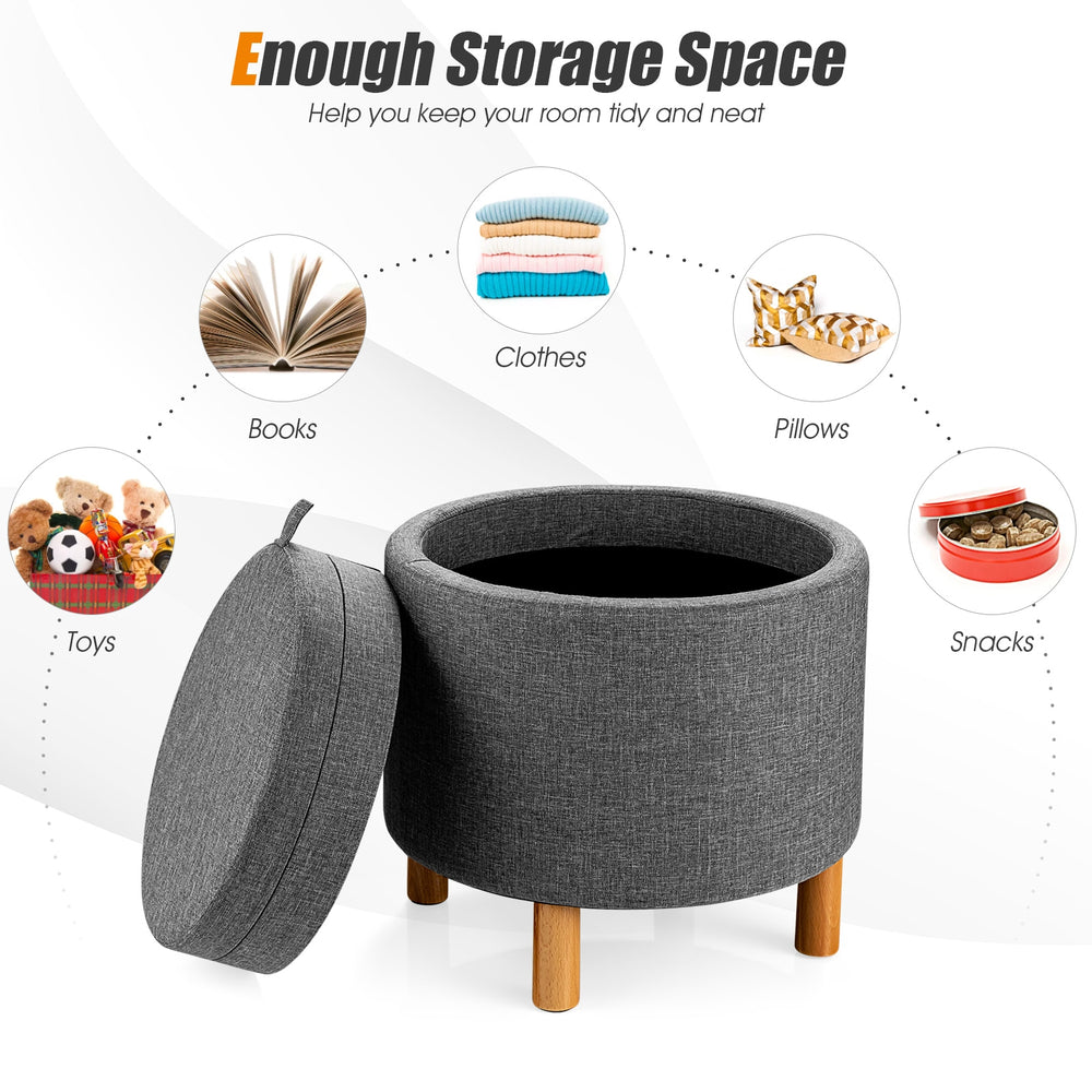 Round gray fabric storage ottoman with removable lid and wooden tray, perfect for storing toys and blankets in any room.