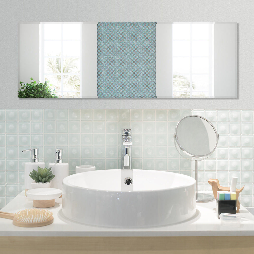 Frameless full-length mirror, 43 x 15 inches, mounted above a stylish bathroom sink for convenient daily use.