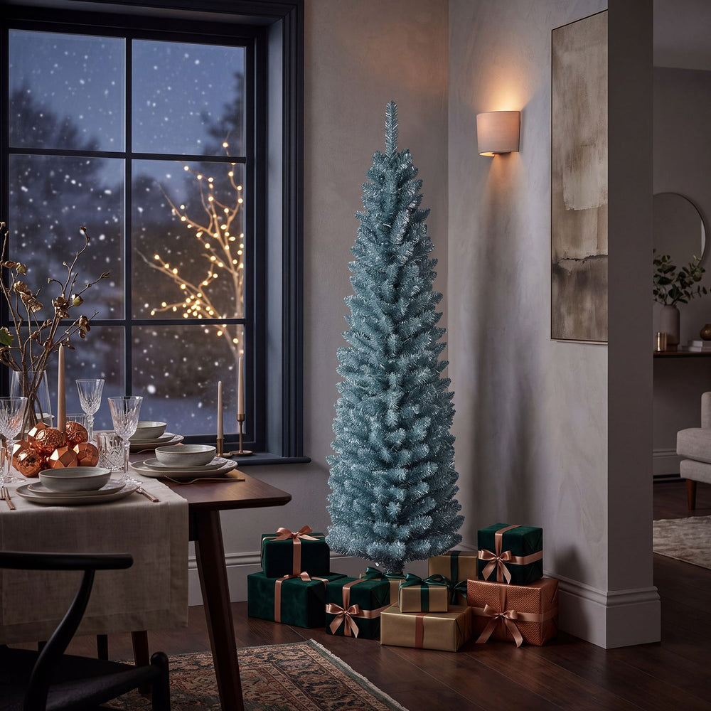 Slim 5-foot artificial Christmas tree with silver and gray-green PVC branch tips, perfect for festive home decoration.