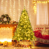 6-foot artificial Christmas tree adorned with warm white LED lights, set in a cozy holiday scene with decorations.