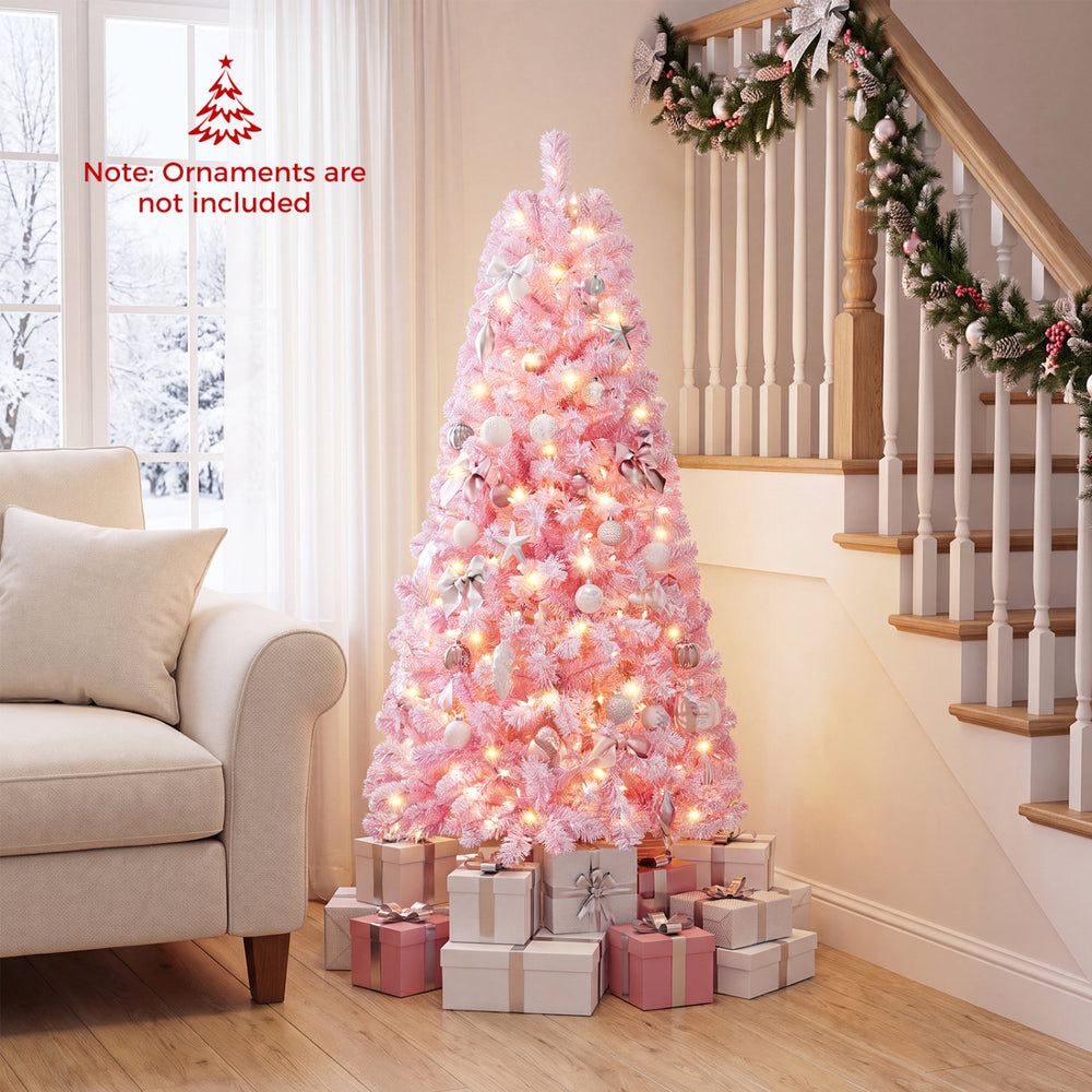 Flocked pink 5 ft Christmas tree with warm white LED lights and 432 branch tips, perfect for festive holiday decor.