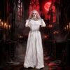 Life-size 5.7 ft animated ghost bride decoration with glowing red eyes and head-turning action for Halloween scares.
