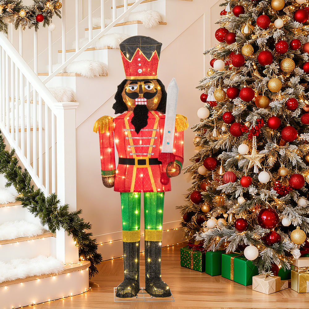 5 FT lighted Christmas nutcracker with glitter sword, decorated in red and gold, perfect for outdoor holiday displays.