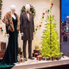 5 FT pre-lit artificial Christmas tree featuring 670 warm white lights, perfect for creating a festive atmosphere.