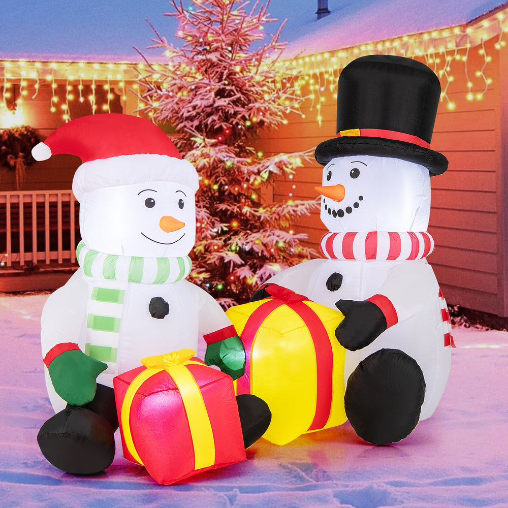Adorable 5-foot inflatable snowmen with vibrant gift boxes, designed for a cheerful holiday display indoors or outdoors.