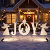 Joyful white nativity yard sign set featuring angels and a holy family silhouette, perfect for outdoor holiday displays.