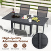 Outdoor dining table set featuring an extendable aluminum table and 4 stackable chairs, ideal for backyard meals.