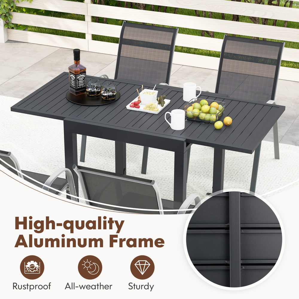 Outdoor dining table set featuring an extendable aluminum table and 4 stackable chairs, ideal for backyard meals.