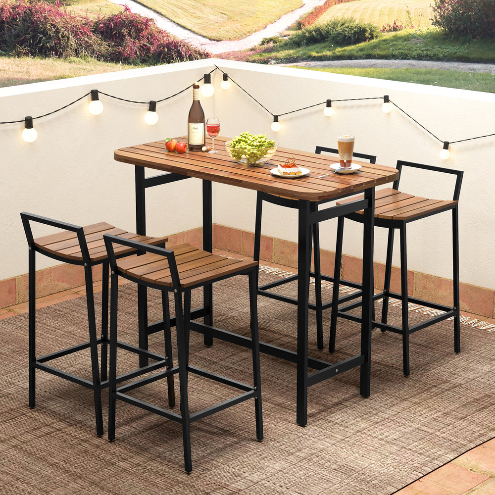 Bar height acacia wood table set with metal frame, featuring four chairs, ideal for outdoor dining on a patio.