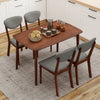 Rectangular dining table with four ergonomic fabric chairs in gray, perfect for kitchens or breakfast nooks.
