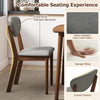 Gray dining chair with ergonomic slanted backrest and faux linen fabric, perfect for a comfortable dining experience.