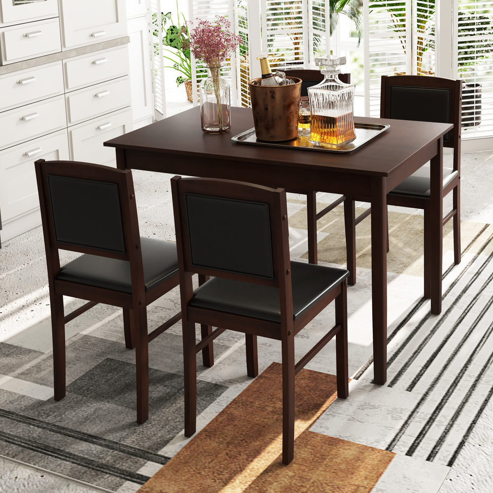 Rectangular dining table with brown veneered MDF top and rubber wood legs, surrounded by four padded chairs for cozy.