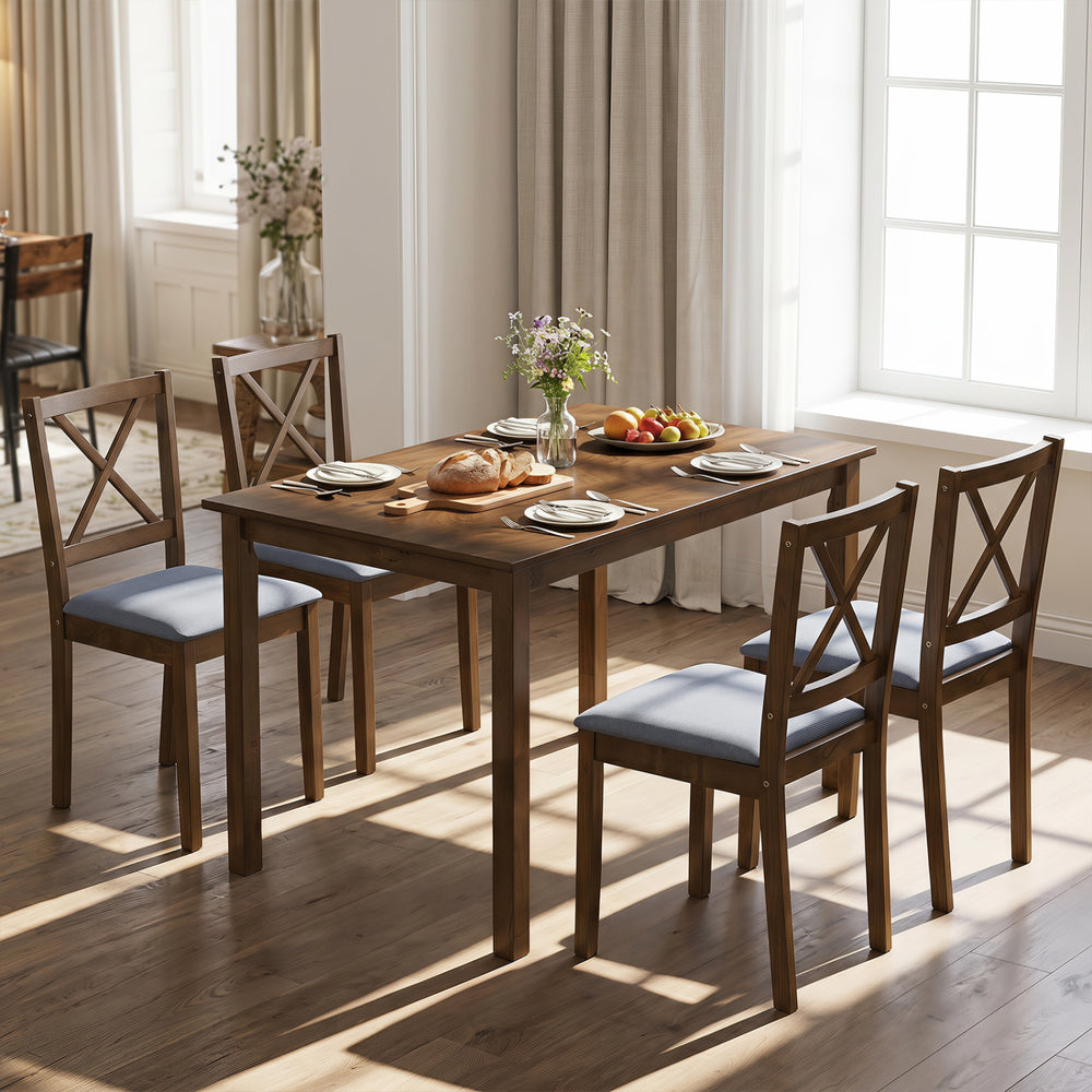 Rectangular dining table with four chairs, showcasing breathable gray fabric upholstery for comfort and a classic vintage design.