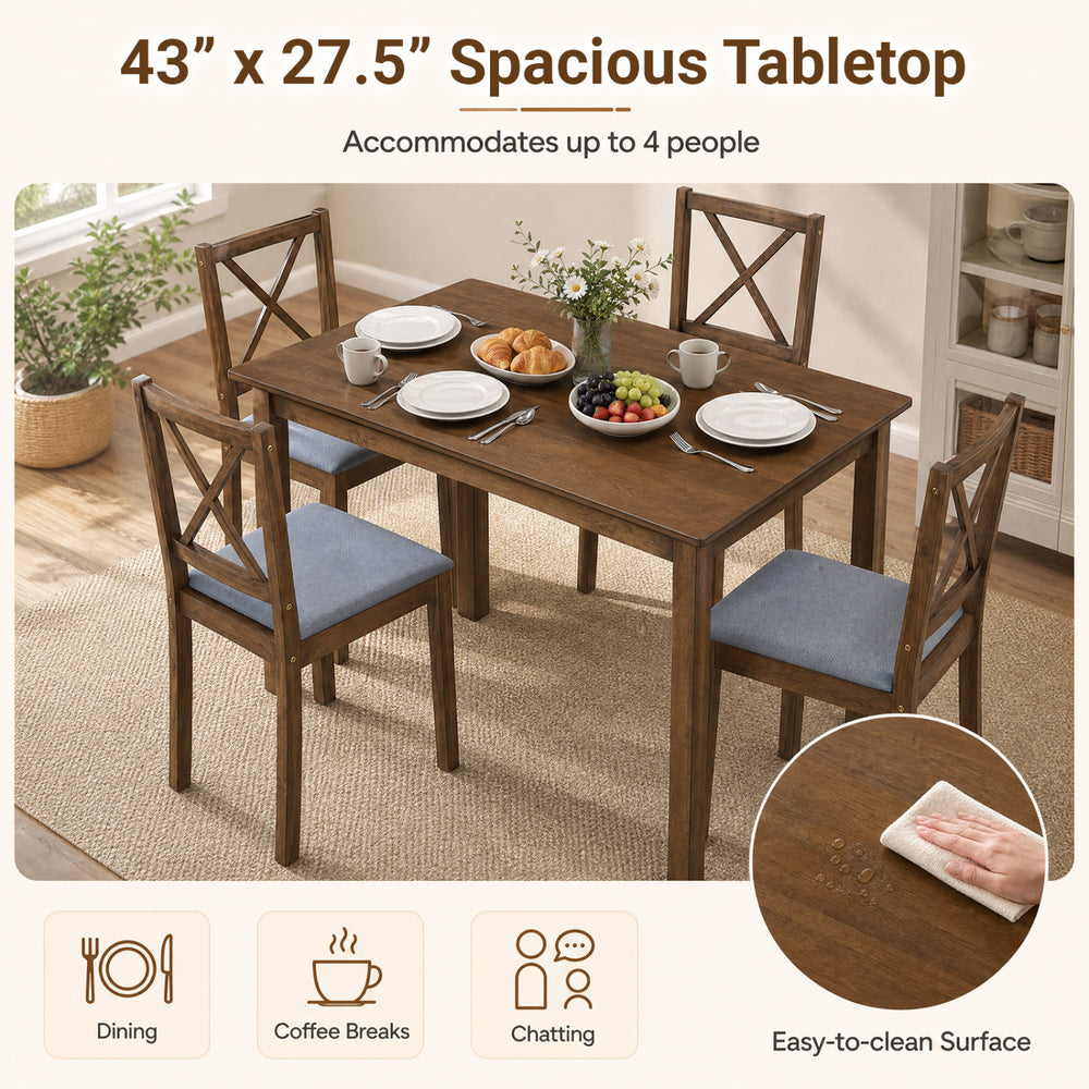 Rectangular dining table with four fabric chairs in gray, accommodating up to 4 people for dining or coffee breaks.