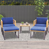 Two navy blue cushioned chairs with acacia wood frames and a coffee table, perfect for backyard or poolside relaxation.