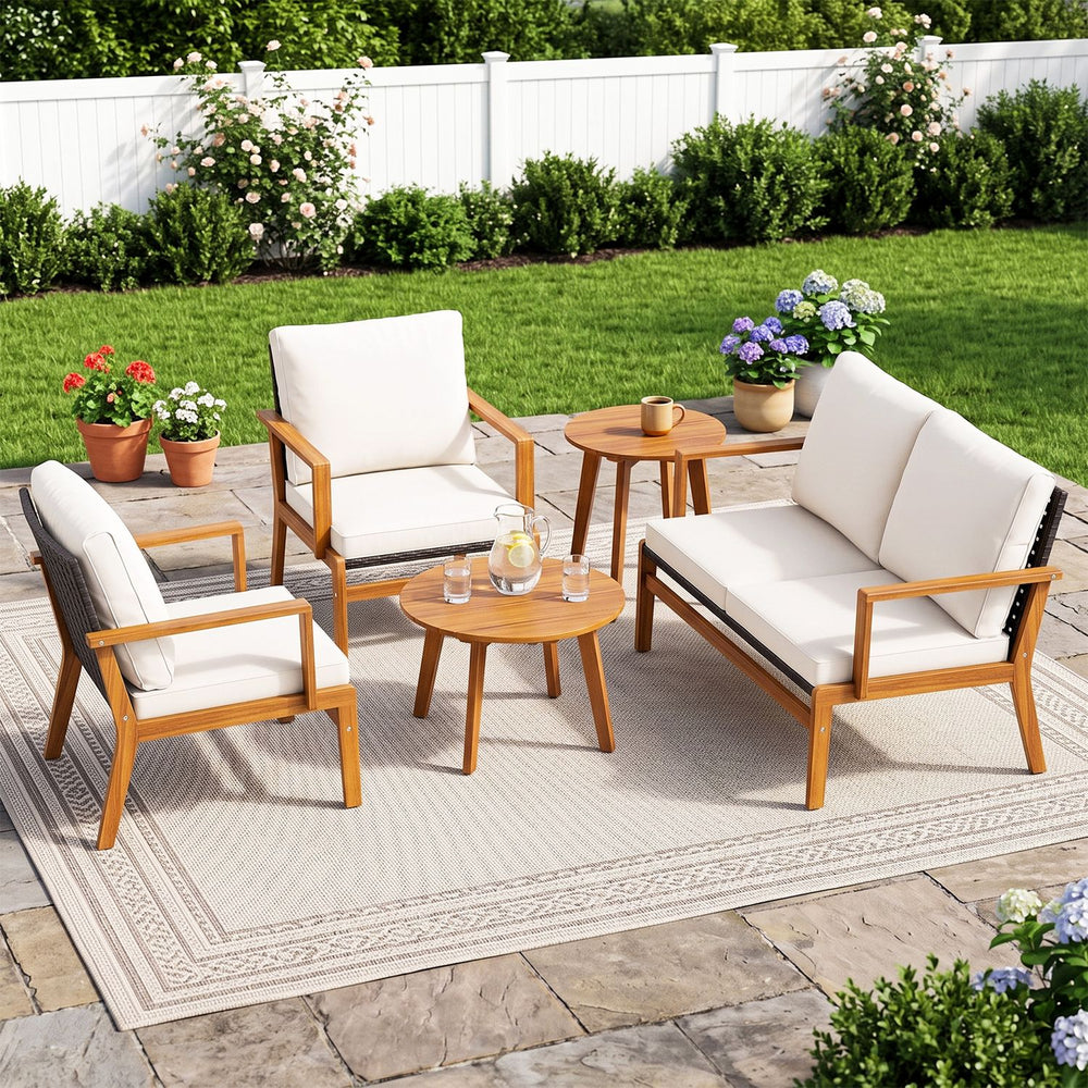 Single acacia wood chair with soft white cushion and ergonomic design, ideal for comfortable outdoor seating.