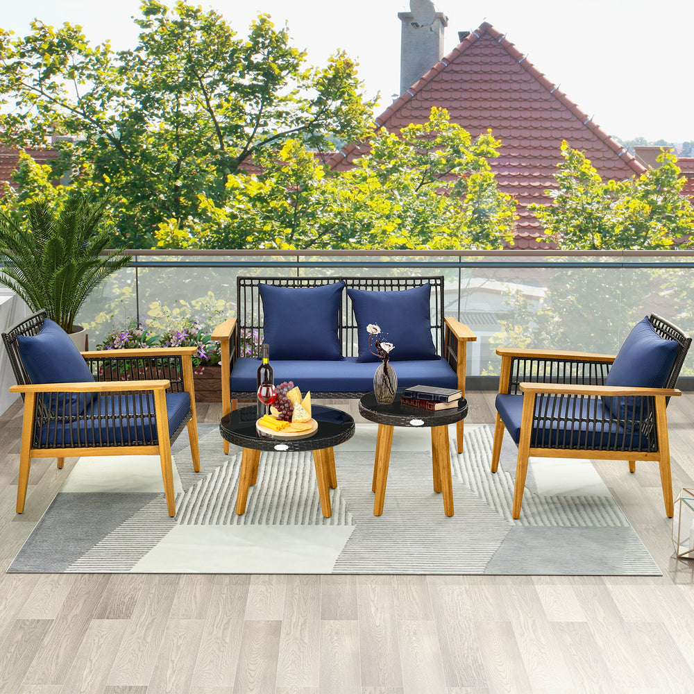 5-piece outdoor conversation set featuring navy cushions, acacia wood frame, and two coffee tables for poolside.
