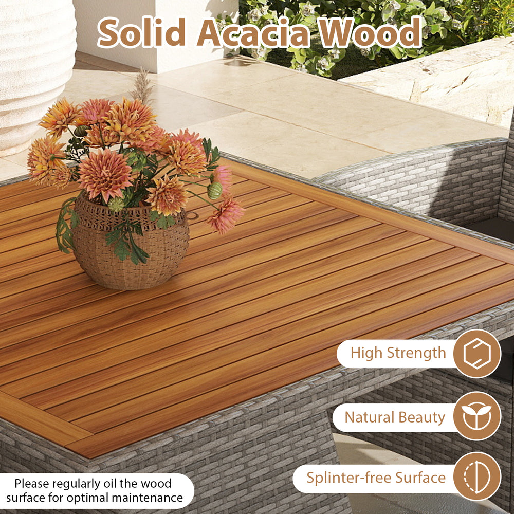 Close-up of the solid acacia wood table surface from the 5-piece PE wicker patio dining set, showcasing its natural.