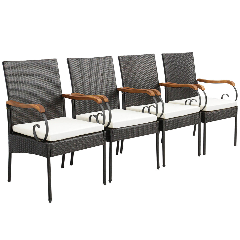 Four patio dining chairs made of hand-woven PE rattan with soft cushions and ergonomic armrests for comfortable seating.