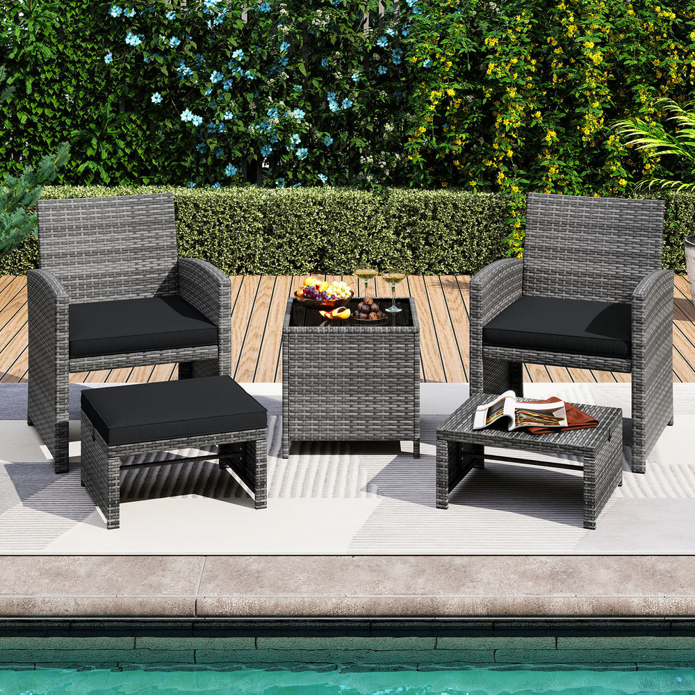 5-piece patio furniture set featuring PE wicker lounge chairs, 2 ottomans, and a tempered glass table for outdoor.