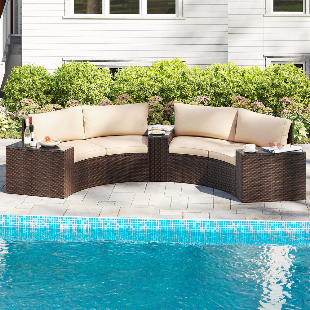 Curved 5-piece patio furniture set with beige cushions and PE rattan, perfect for poolside relaxation.
