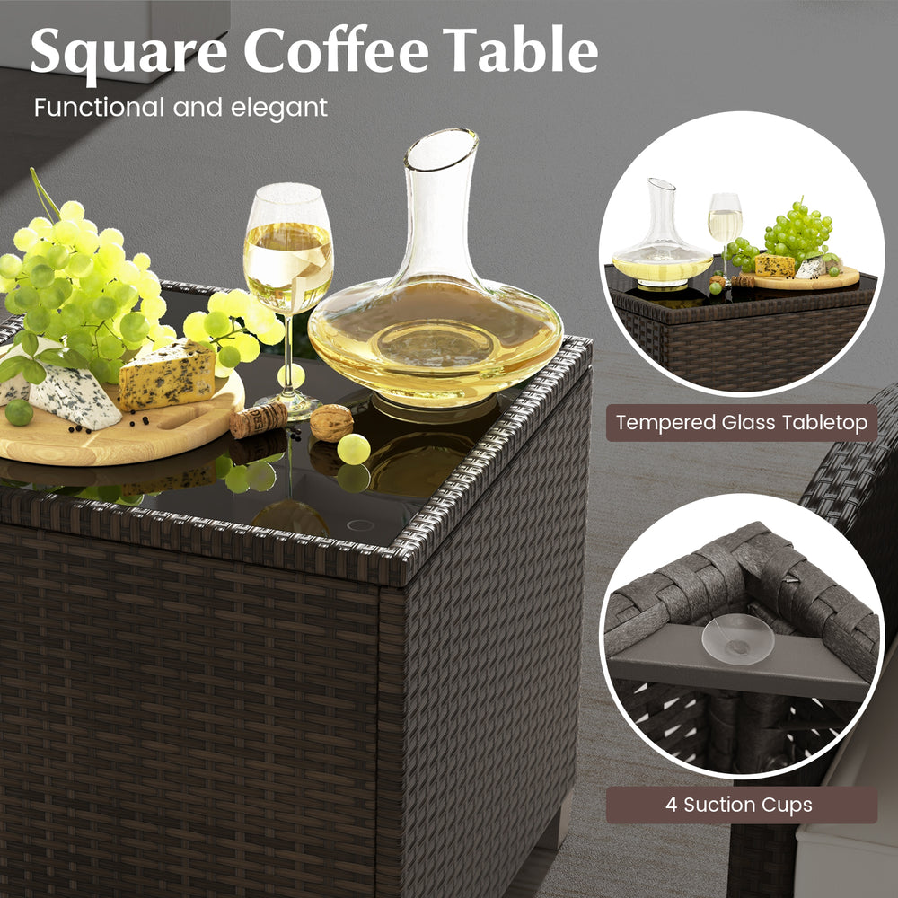 Square coffee table with tempered glass top and rattan design, perfect for outdoor patio use with drinks and snacks.