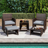 Patio rattan furniture set featuring gray cushions, tempered glass coffee table, and versatile ottoman for outdoor relaxation.