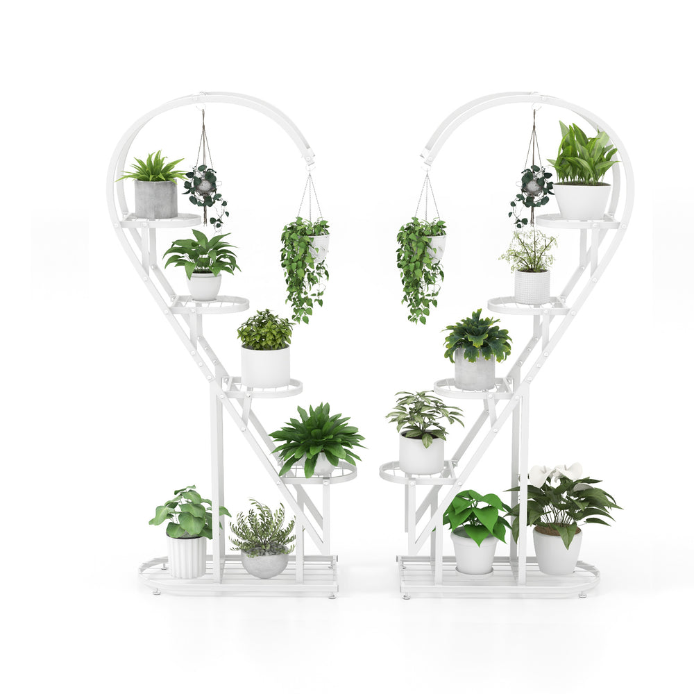 Heart-shaped 5 tier metal plant stand in white, featuring multiple shelves and hanging hooks for decorative plants.