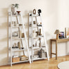 5-tier white modern bookshelf with a wood-like surface, ideal for small spaces, displaying decor and plants.
