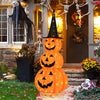 Lighted stacked pumpkins with witch hat, 5 feet tall, featuring 100 LED lights for Halloween yard decoration.