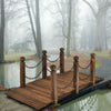 Wooden garden bridge with safety rails and stained finish, perfect for outdoor pathways and rustic decor.