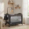 5-in-1 bedside bassinet in gray with detachable changing table, mesh panels, and plush toys for safe co-sleeping.