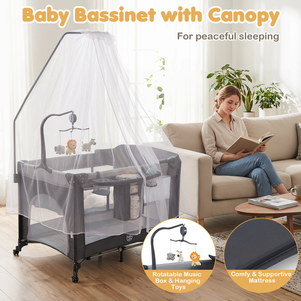 Portable baby bassinet with canopy, music box, and hanging toys, designed for peaceful sleeping and playtime activities.