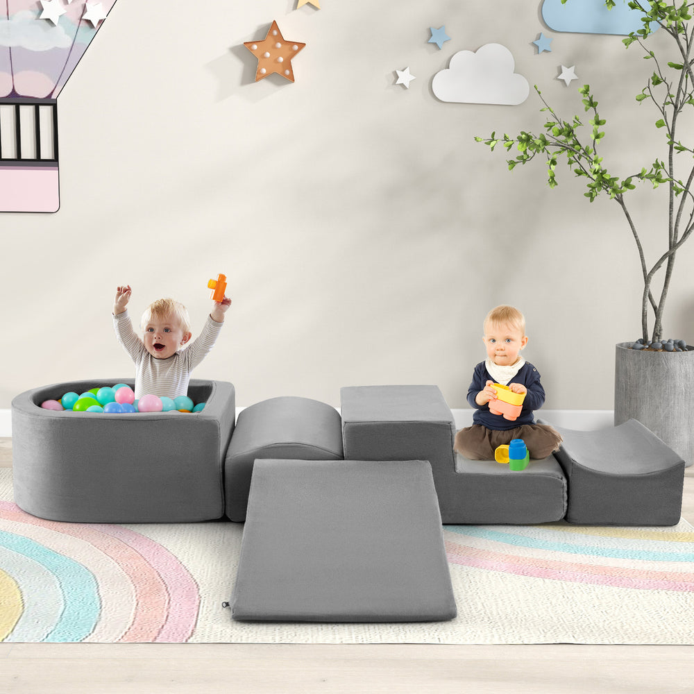 Gray 5-piece climb and crawl playset with ball pit, featuring a slide and various shapes for kids' imaginative play.