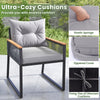 Gray outdoor chair with cozy cushions, PE rattan, and acacia wood armrests, perfect for backyard relaxation.