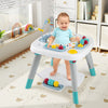 Toddler standing at the 6-in-1 Baby Activity Center, exploring various interactive toys and engaging features.