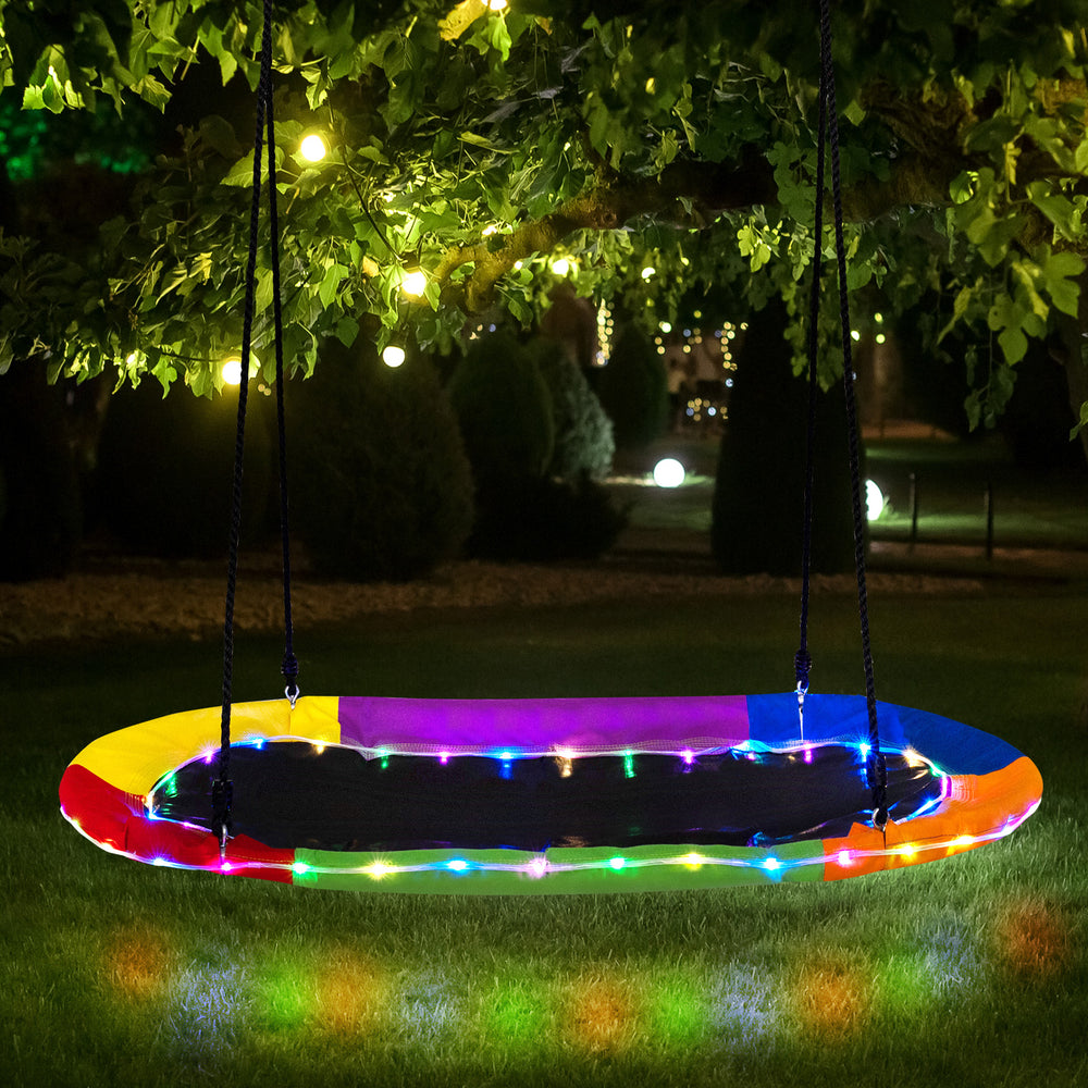 Colorful 60-inch saucer swing with LED lights, sturdy steel frame, and Oxford fabric seat, perfect for nighttime fun.