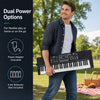 61-key keyboard piano with illuminated keys, power adapter, and microphone for beginners, perfect for home or on-the-go play.