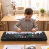 A young boy plays the 61-key black kids piano keyboard with microphone and music stand, enhancing his musical skills.