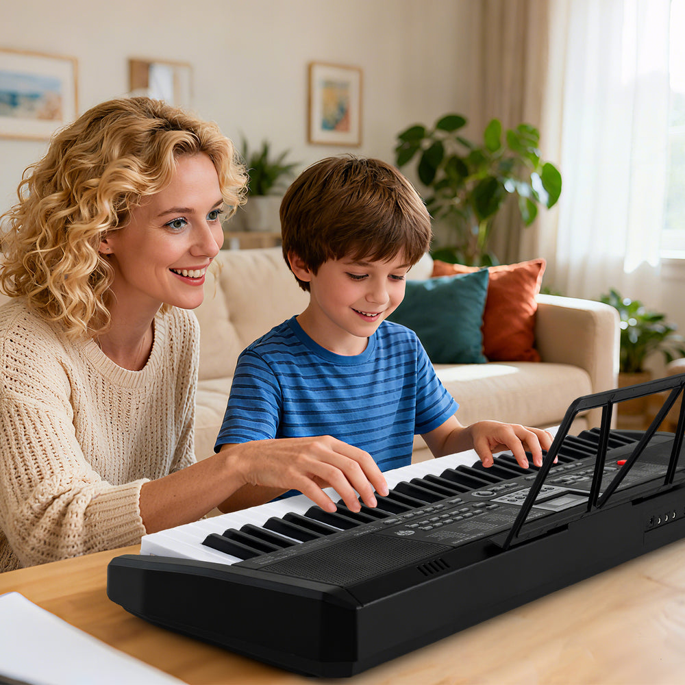 A mother and son play together on a 61-key portable electric piano keyboard, perfect for beginners in black.