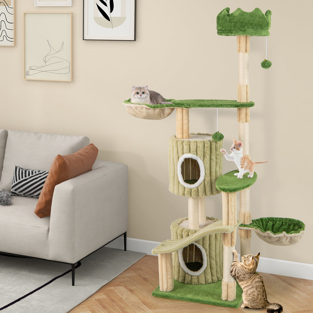Multi-level 63-inch kitten tower in green with two condos, hammocks, and scratching posts for playful cats.