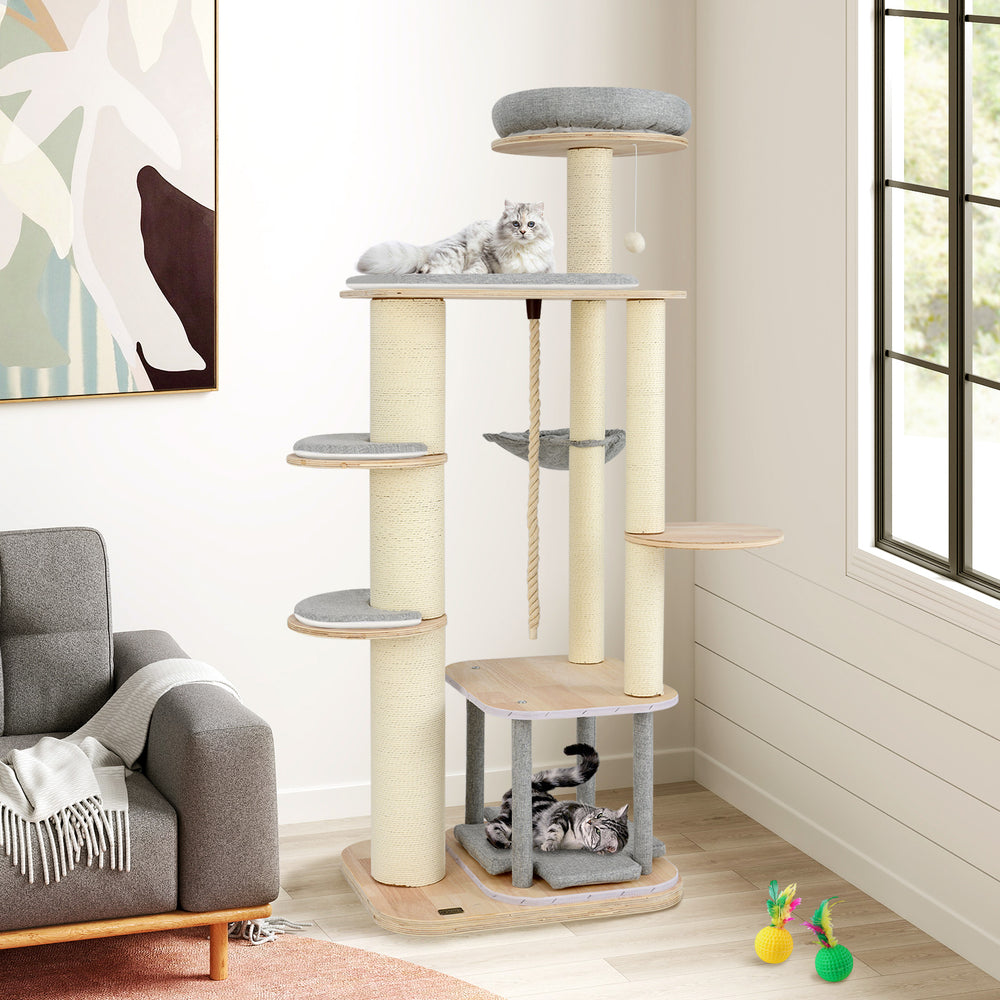 Modern 63-inch tall cat tree with wooden platforms, cozy hammock, and scratching posts for playful relaxation.