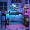U-shaped computer desk in rustic brown with power outlets, keyboard tray, and 5-tier bookshelf for versatile storage.