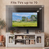 Spacious 63” wooden farmhouse TV stand in white, designed for TVs up to 70", featuring fluted doors and open compartments.