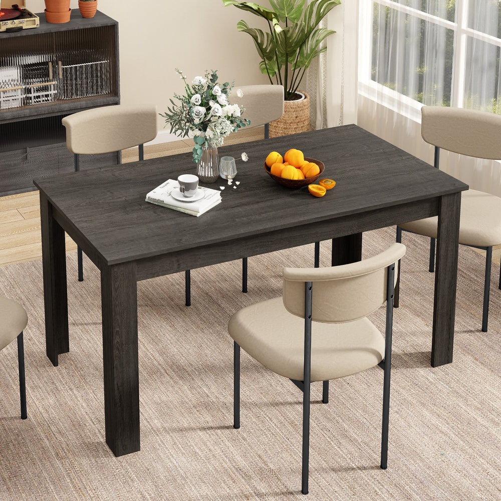 Rectangular gray dining table with spacious surface and four sturdy legs, ideal for kitchen or dining room use.