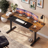 Height adjustable 63 x 24 inch computer desk in rustic brown with three monitors, featuring memory presets and cable.